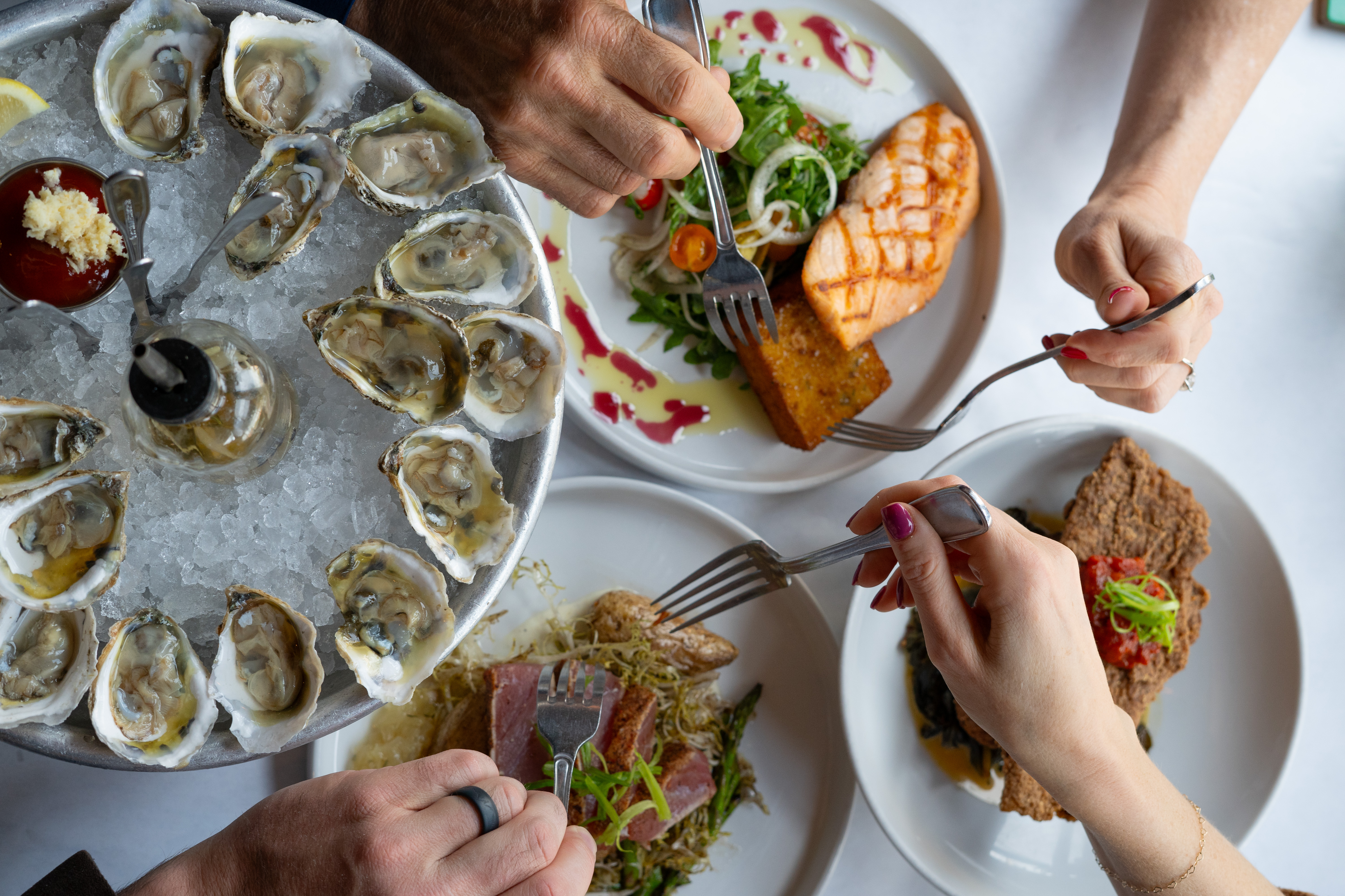 a person holding a plate of food