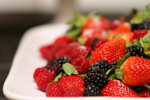 a cake with fruit on a plate
