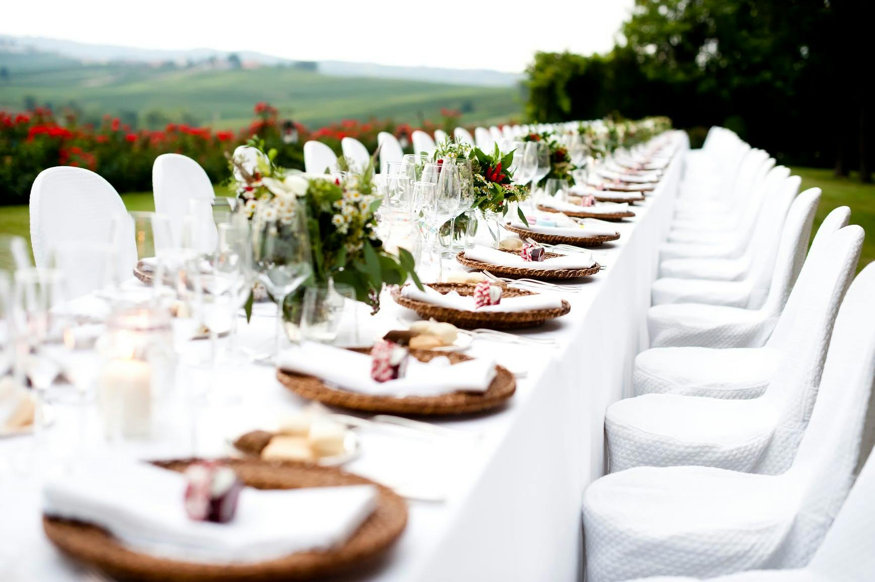 a large table set up with corresponding plates and cutlery