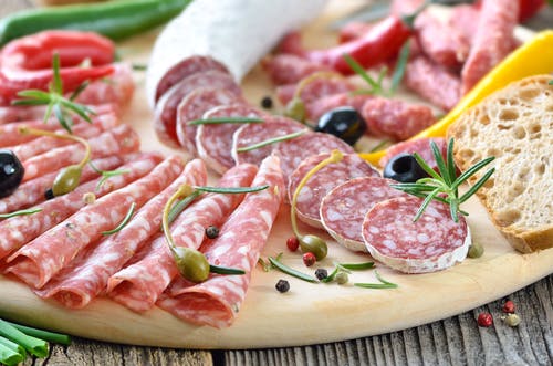 a plate of food with a slice of pizza