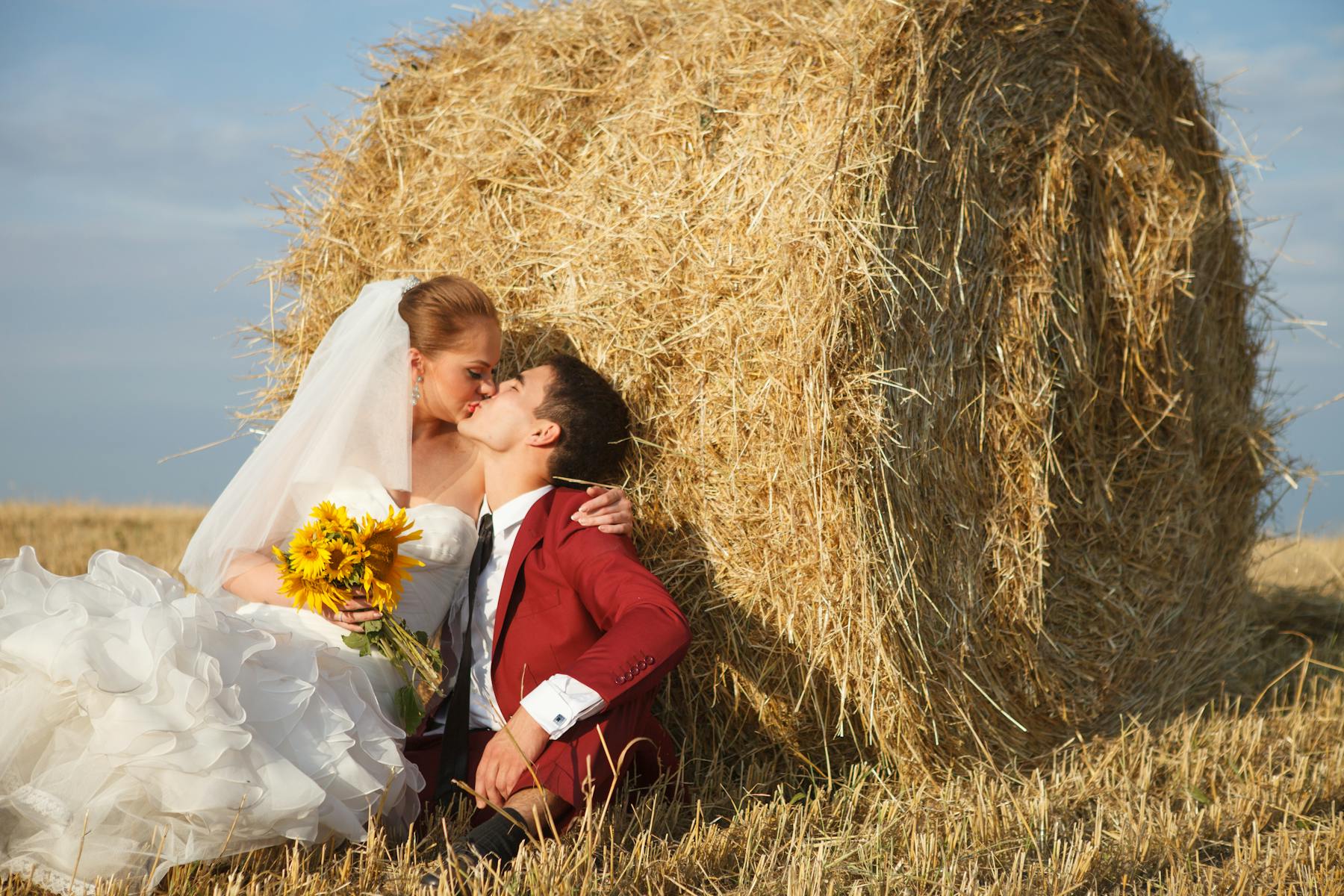 a person sitting on a pile of hay