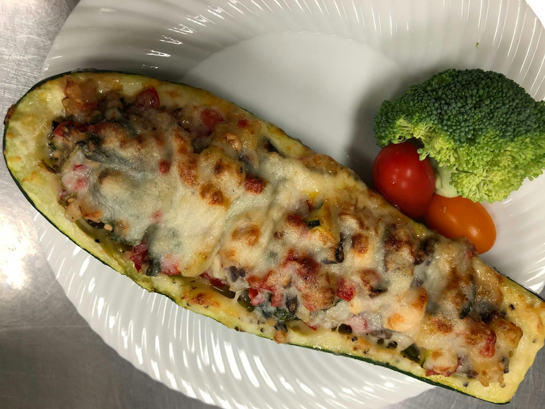 a slice of pizza on a paper plate