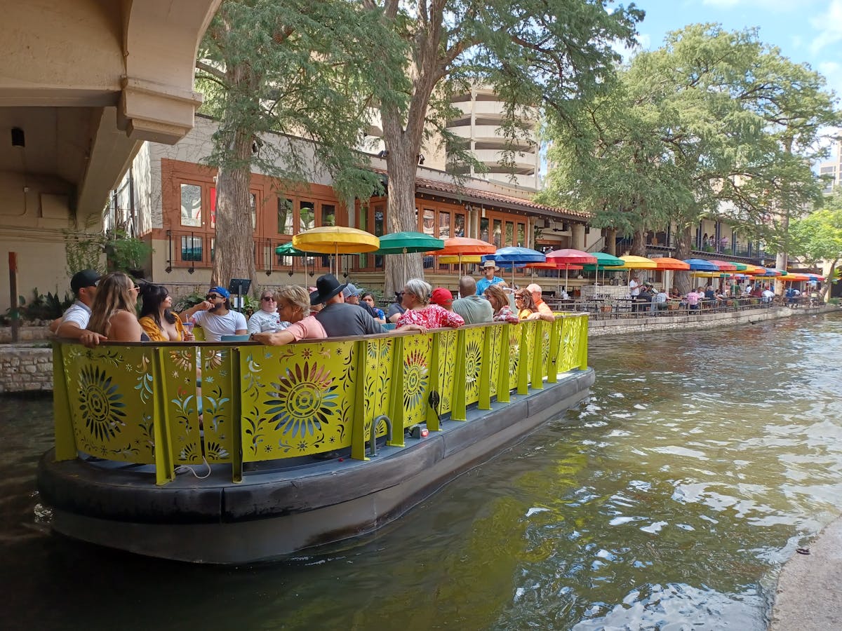a group of people riding on the back of a boat