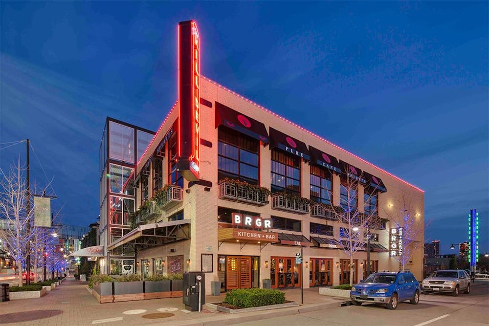 a view of a city street in front of a building