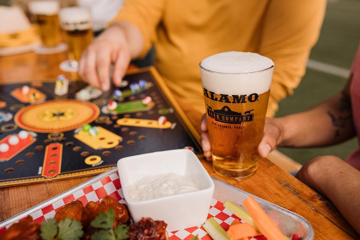 a person sitting at a table with food