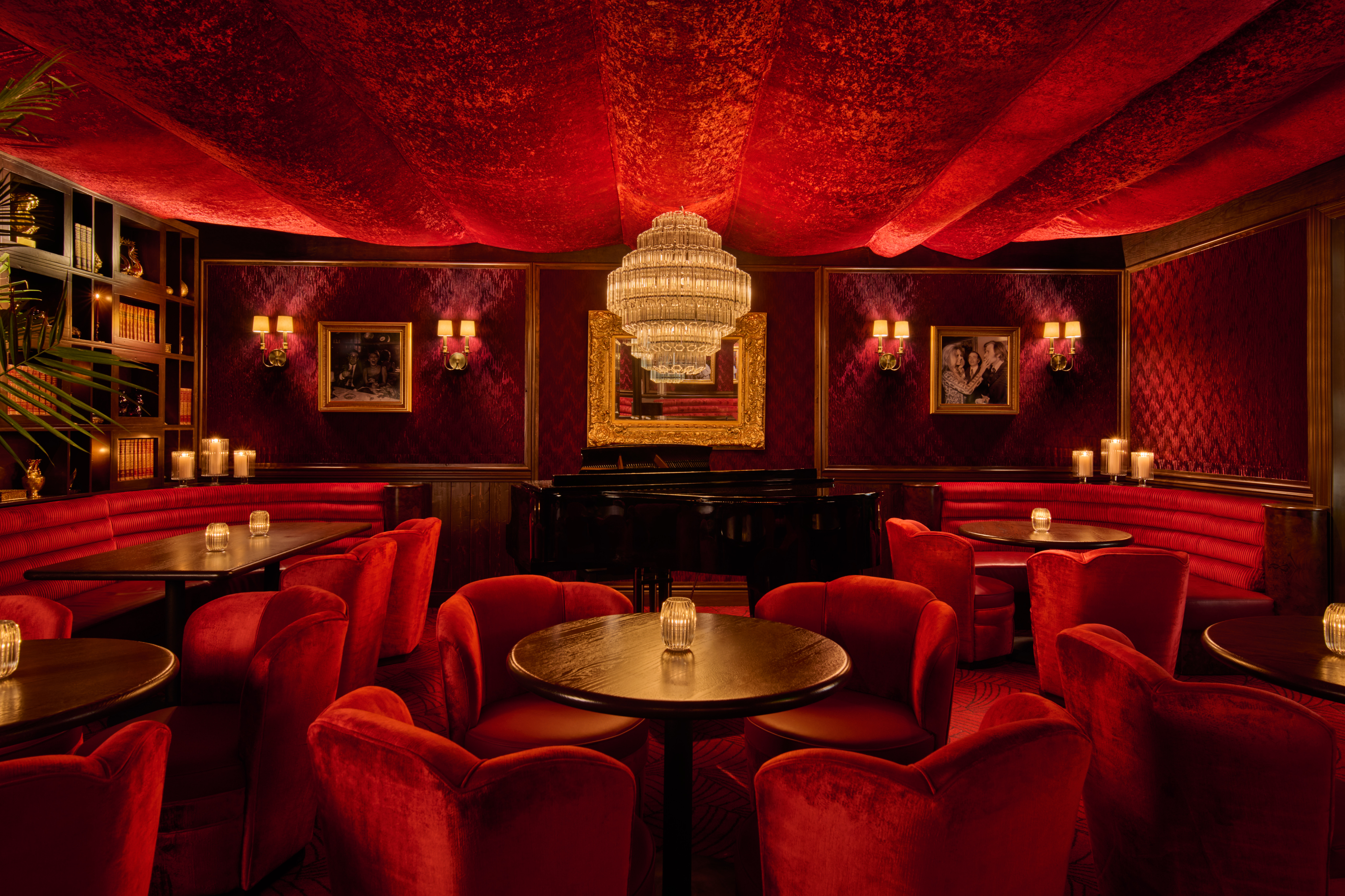 a room with red chairs and tables