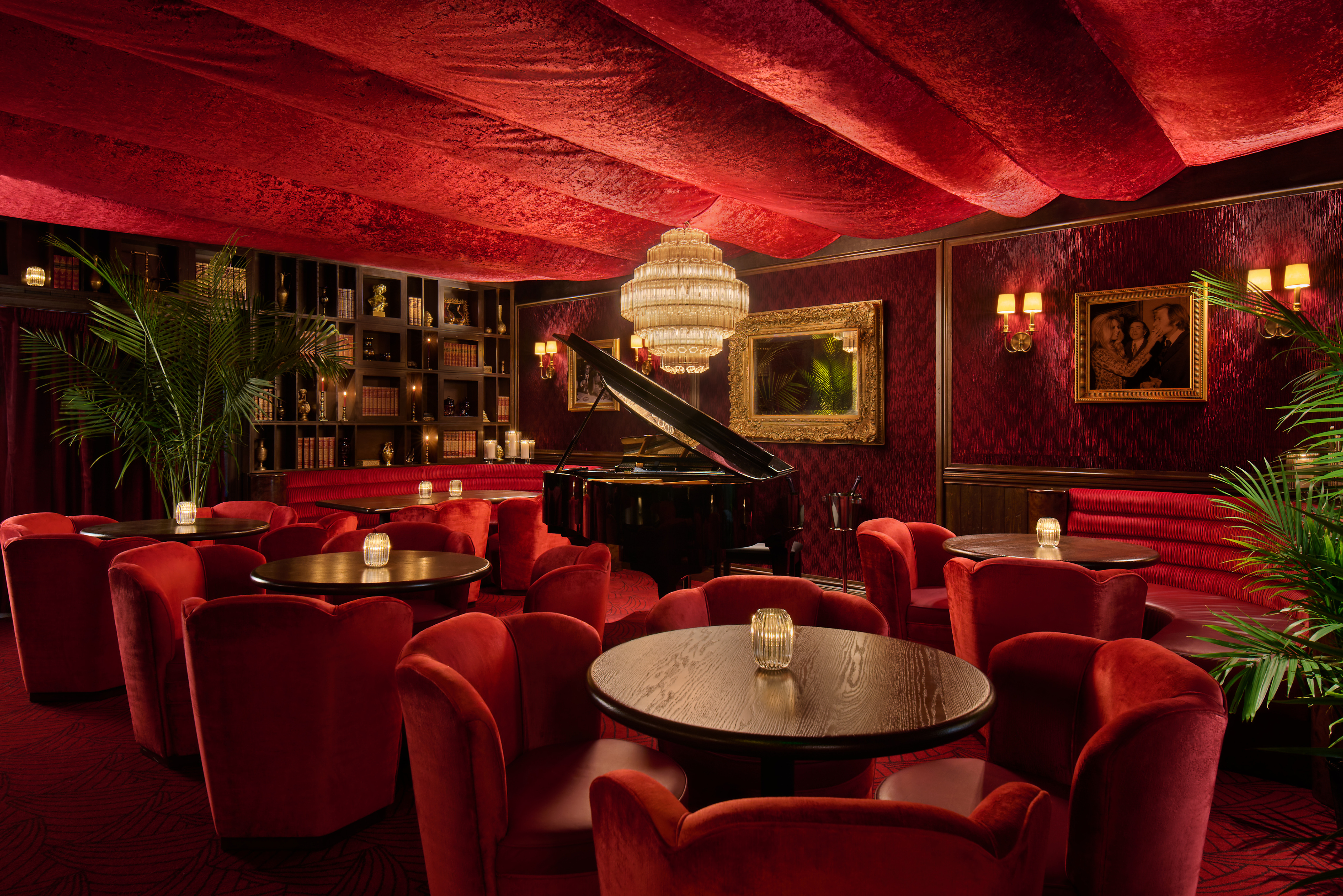 a room with red chairs and tables