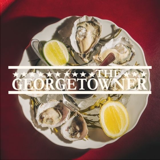 a plate of oysters and lemons