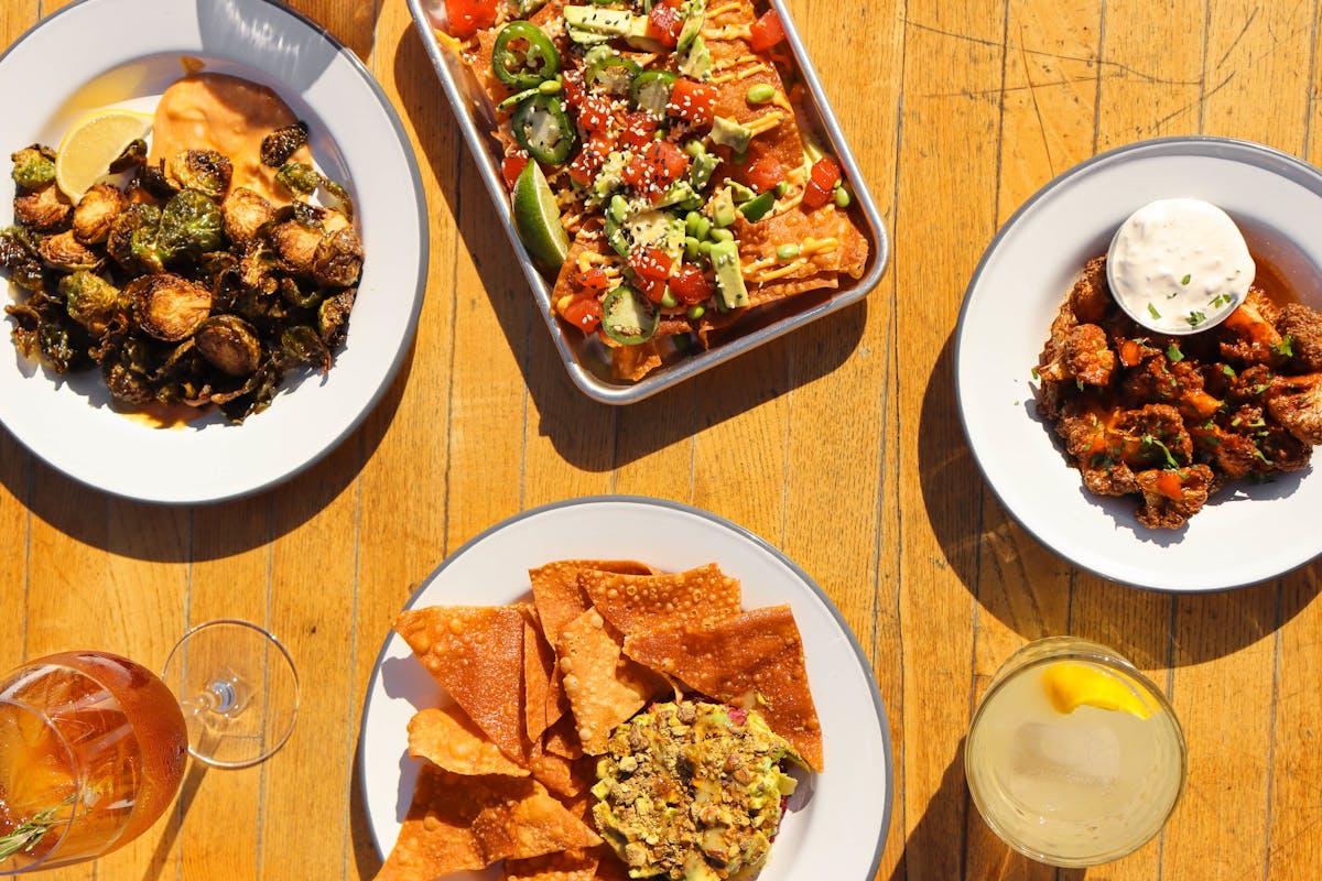 a bunch of food sitting on top of a wooden table