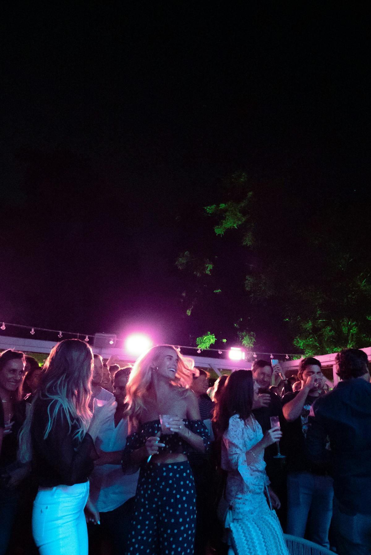 a group of people on a stage in front of a crowd
