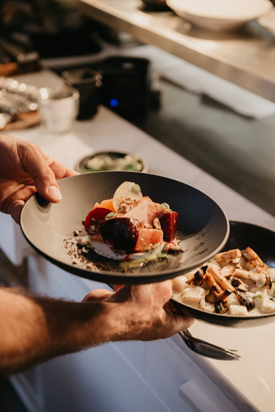 a person cooking food on a plate