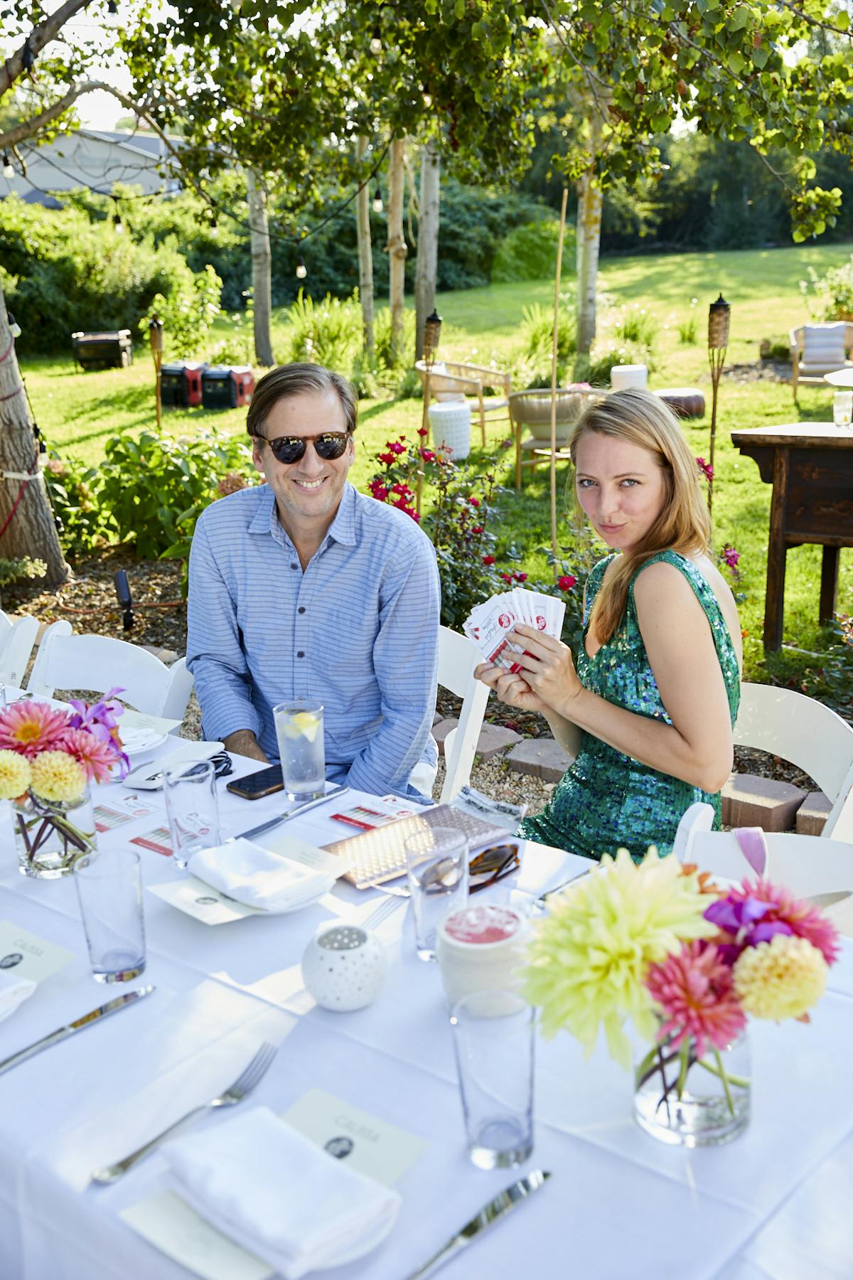 a woman sitting at a picnic table