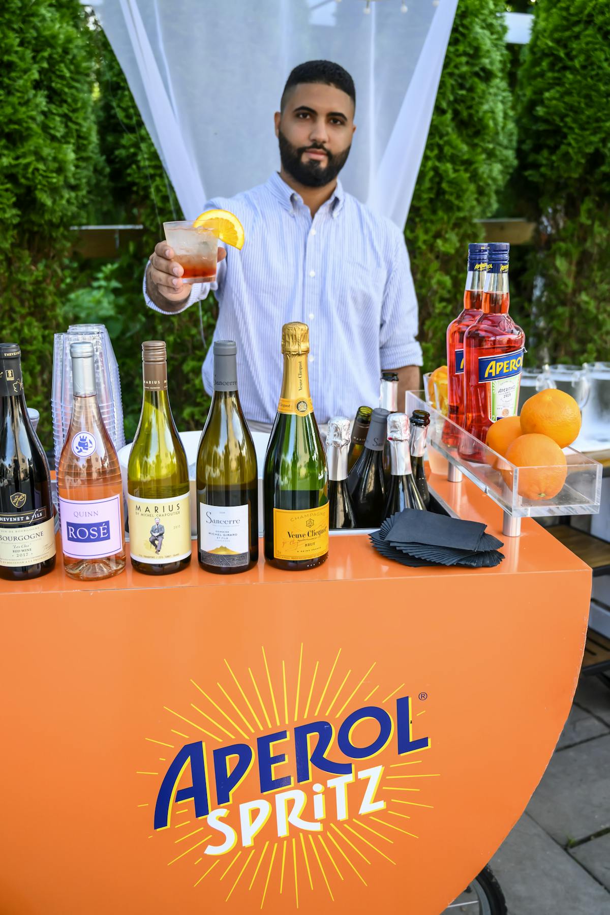 a bartender with a bar cart