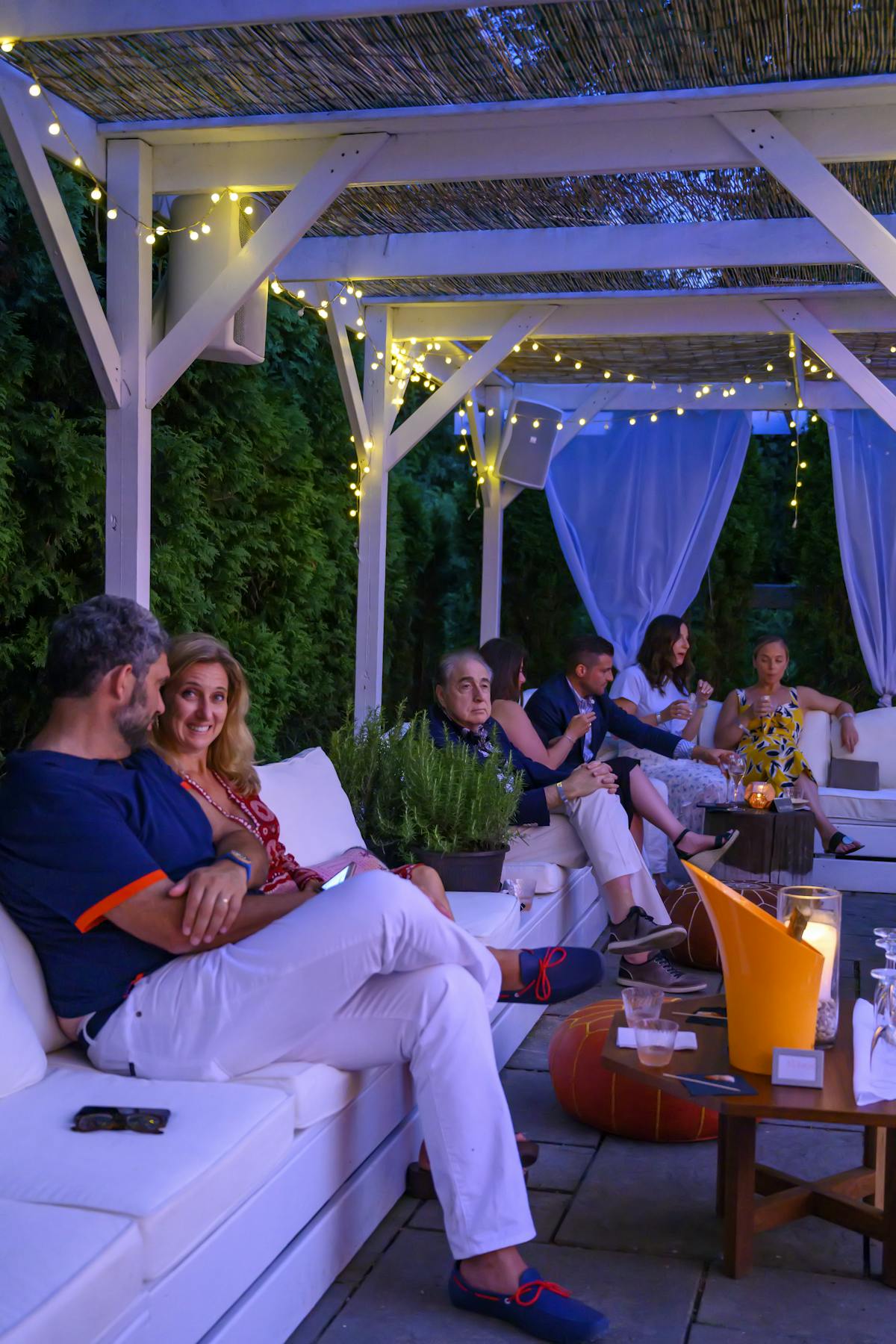 people in a dining tent area