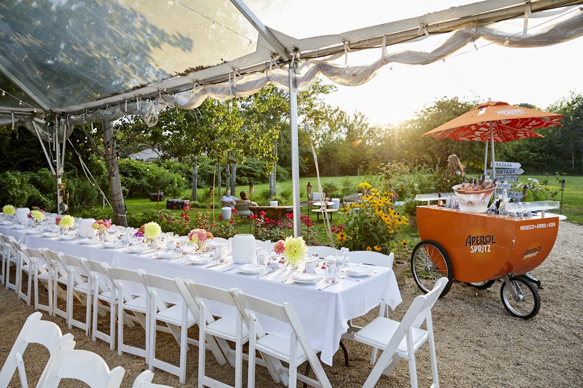 a dining room table in front of a fence