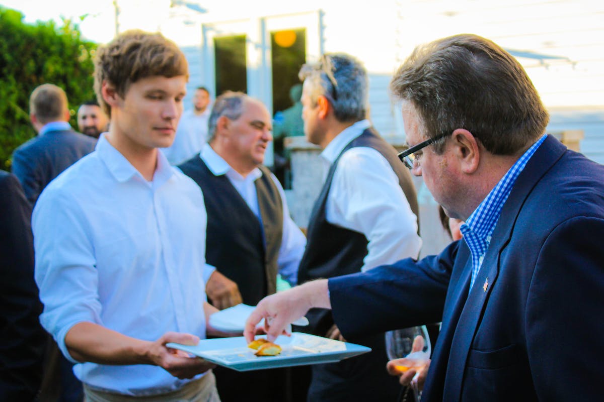 people eating from waiters