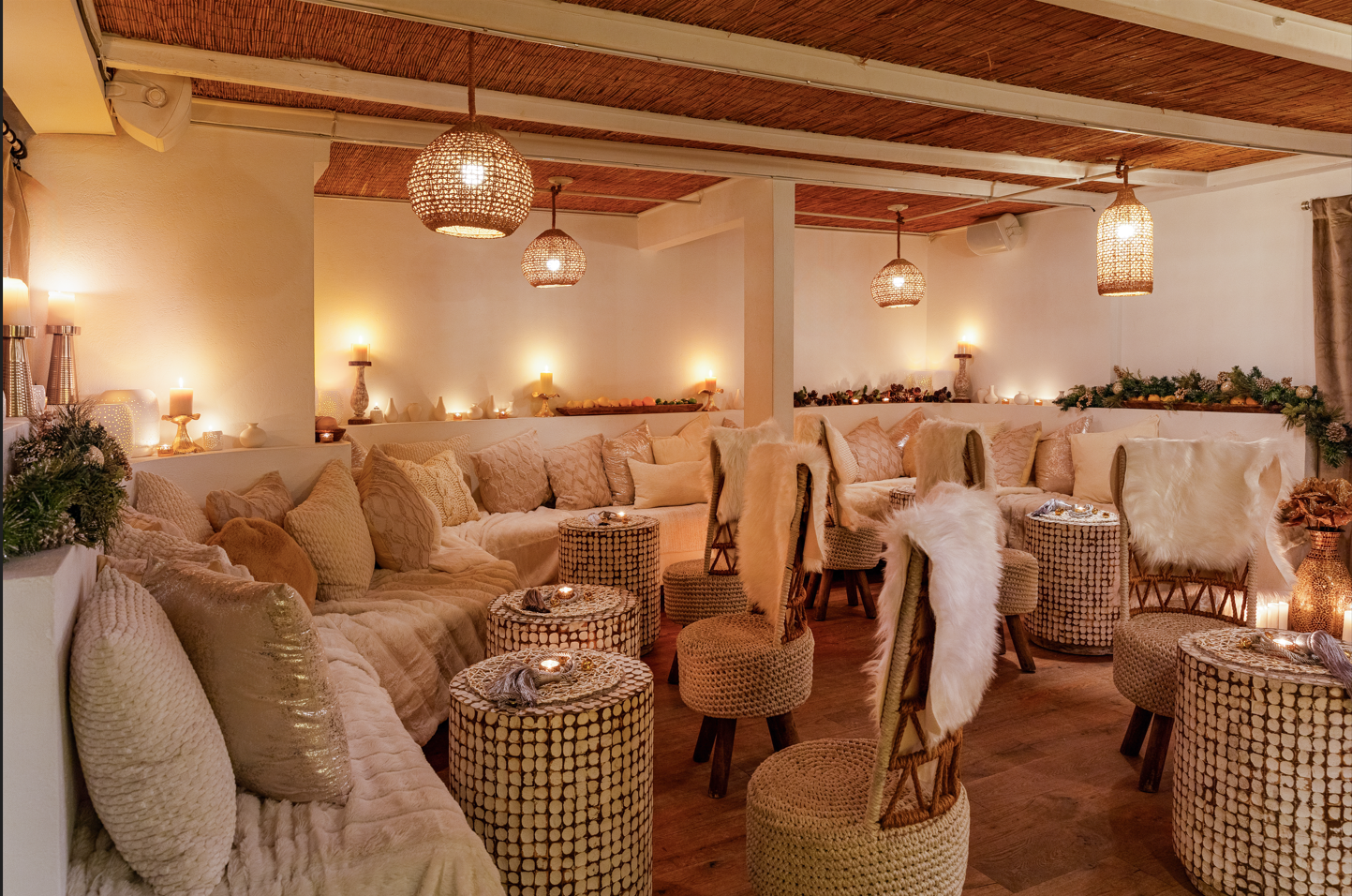 a living room filled with furniture and a large mirror