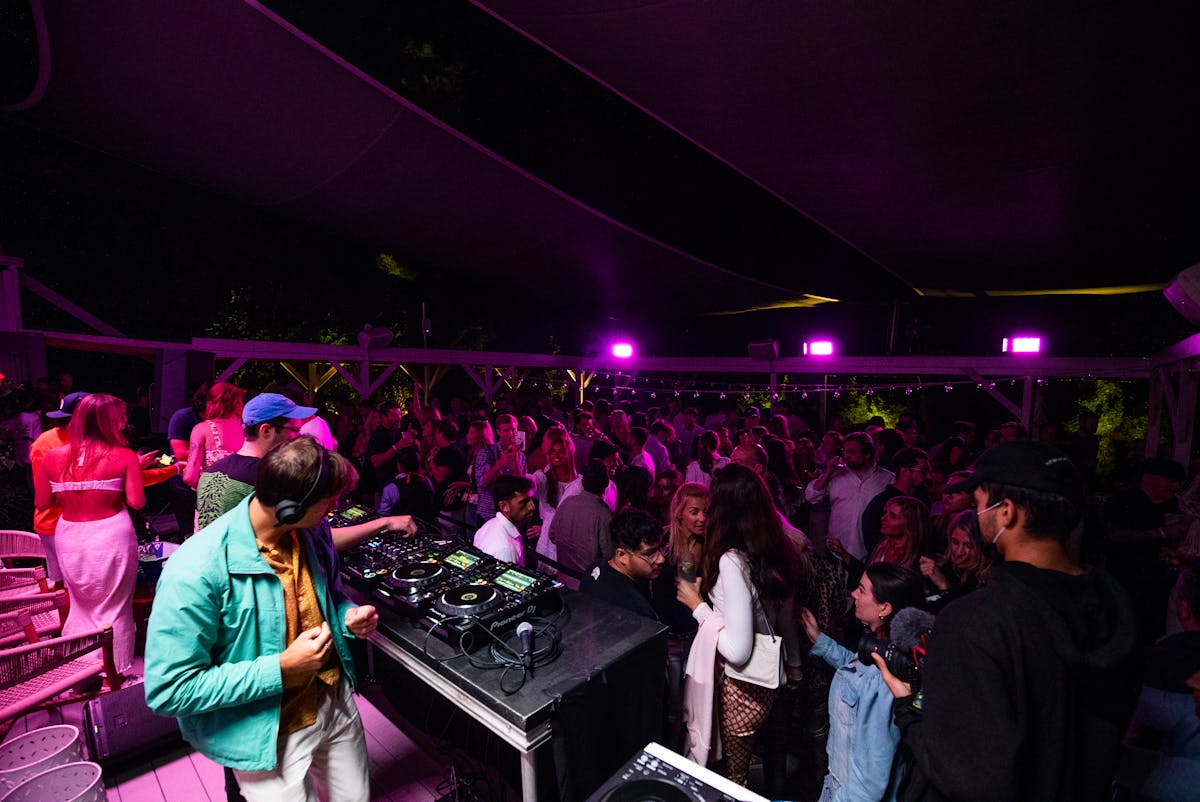 a group of people standing on a stage in front of a crowd