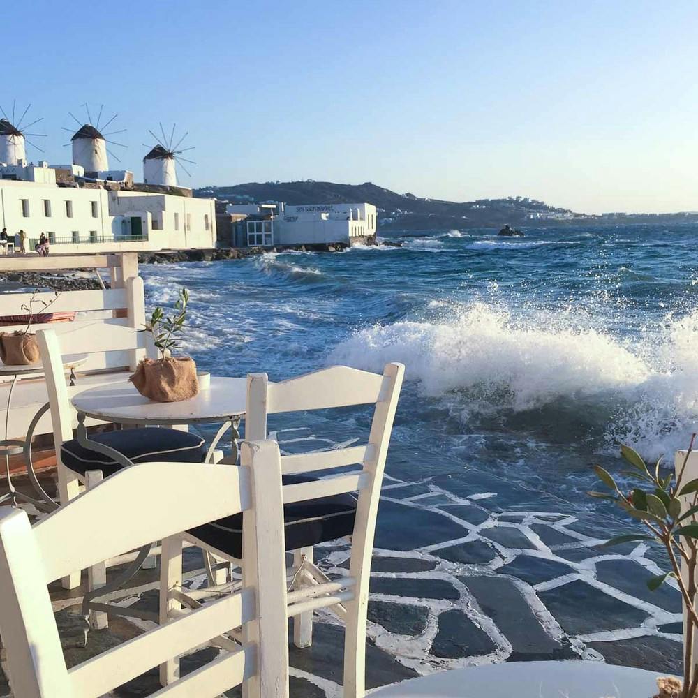 a chair sitting in front of a beach