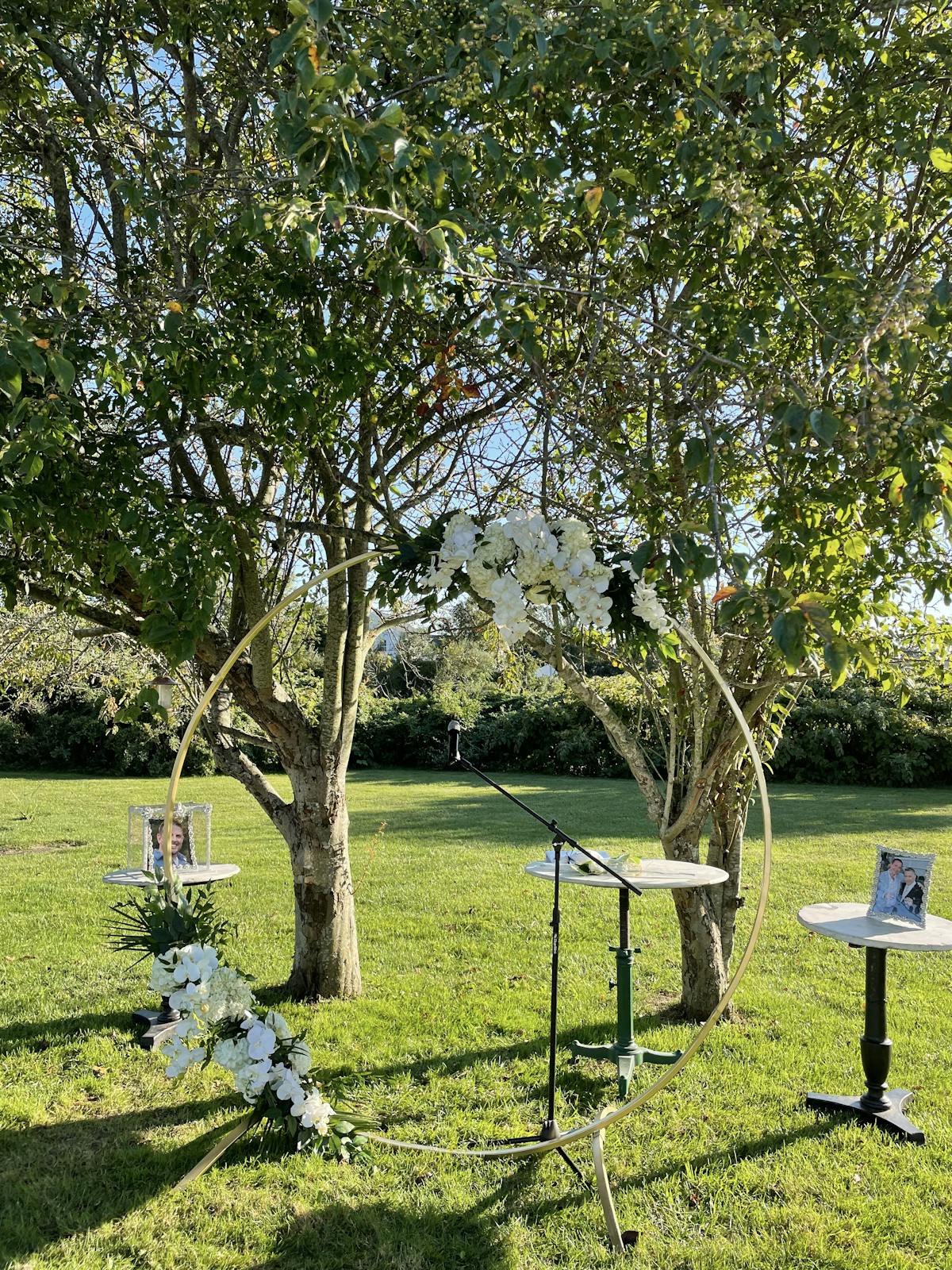 a group of lawn chairs sitting on top of a grass covered field