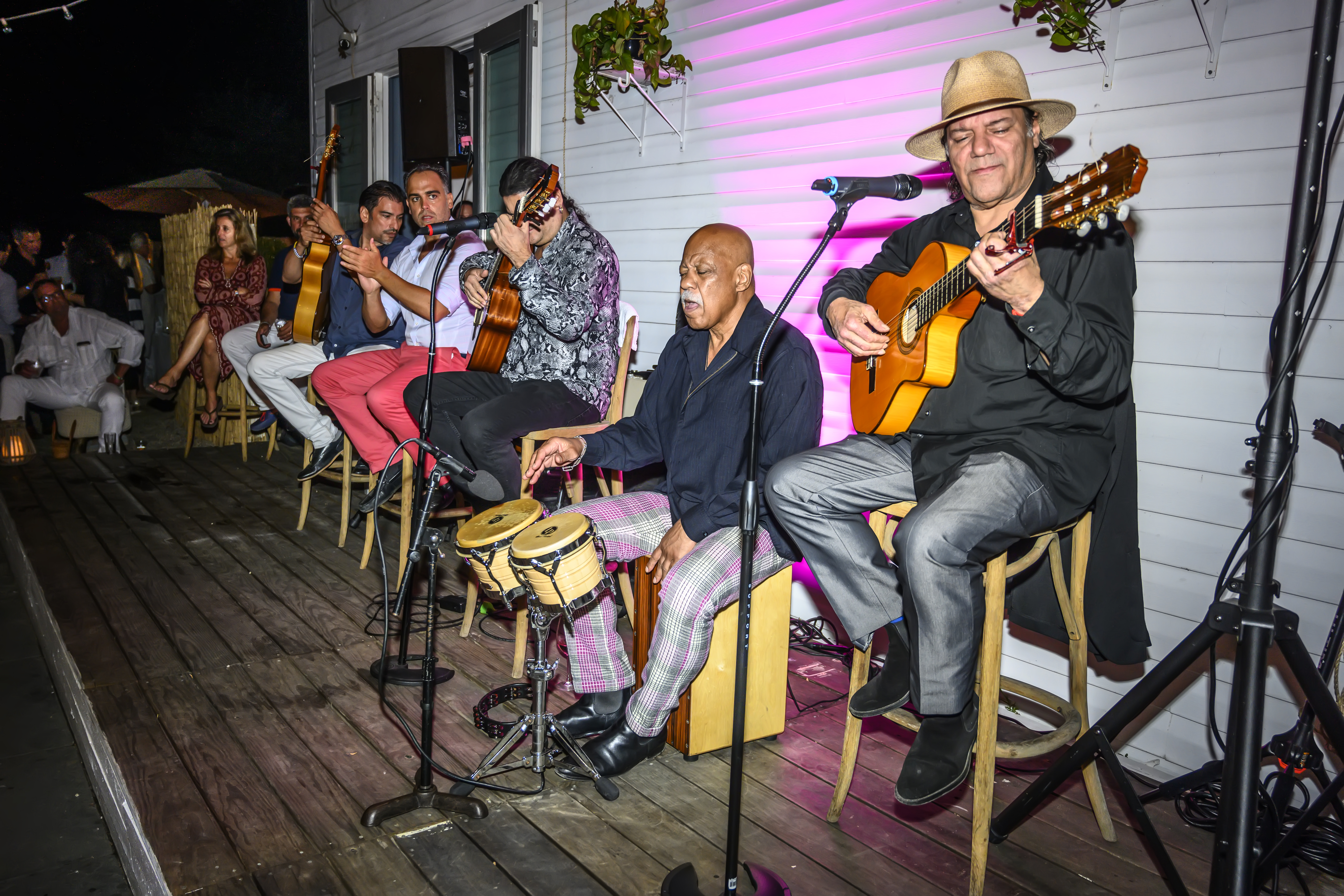 a group of people sitting posing for the camera