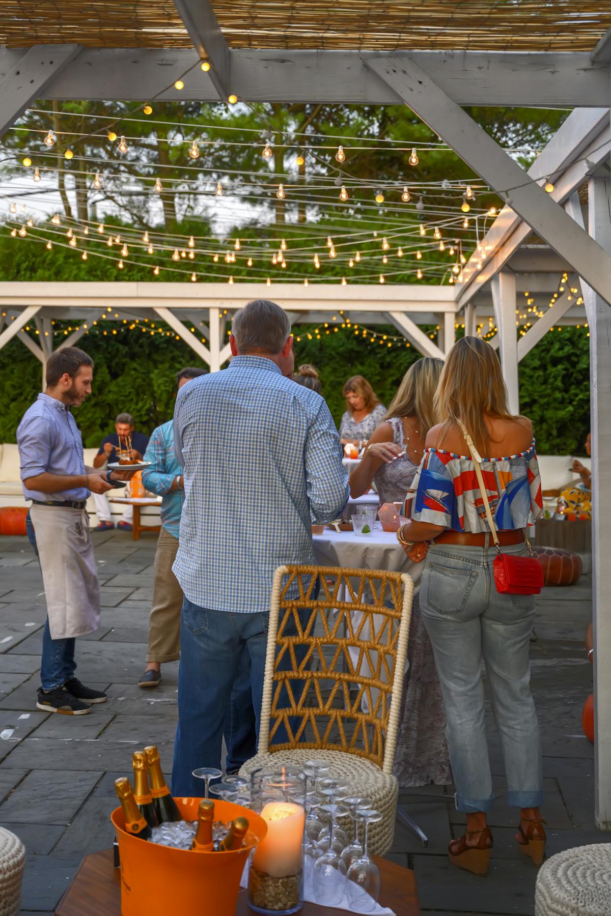 people in a dining tent area