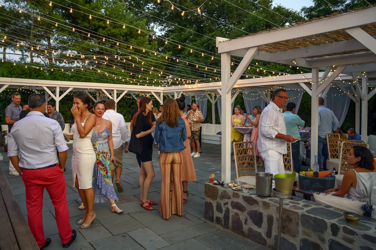 people in a dining tent area