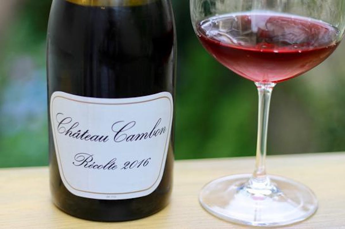 a bottle and a glass of wine
