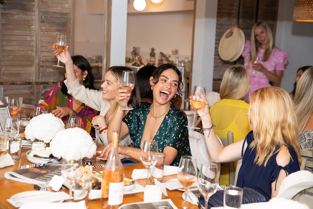 a group of people sitting at a table in a restaurant