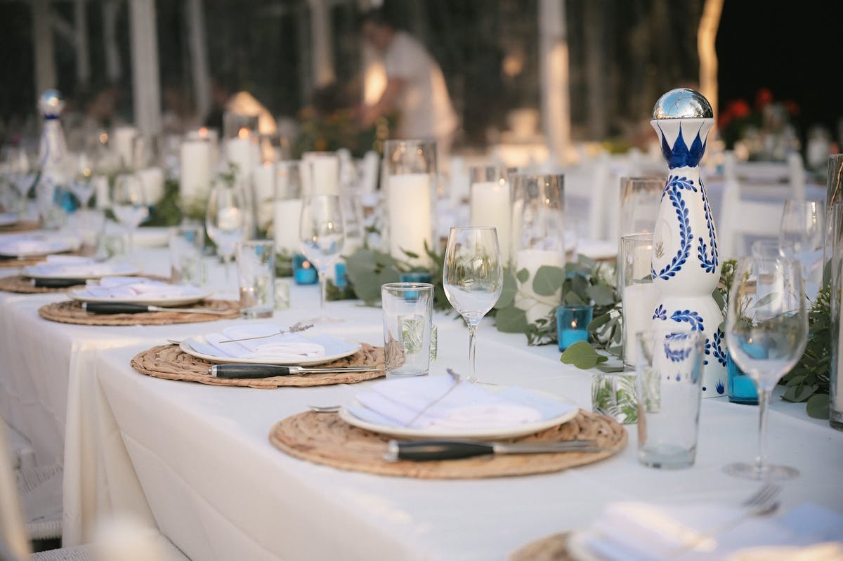 a group of people sitting at a table with wine glasses