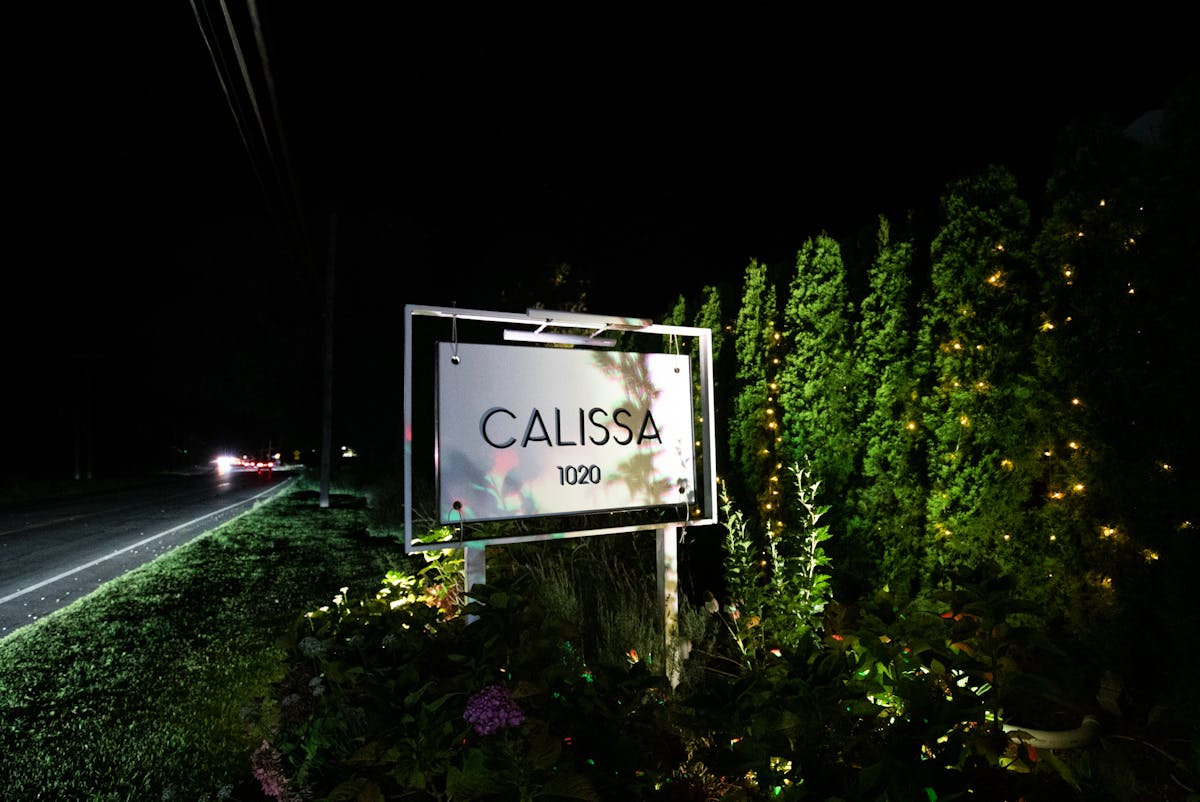 a sign on the side of a road