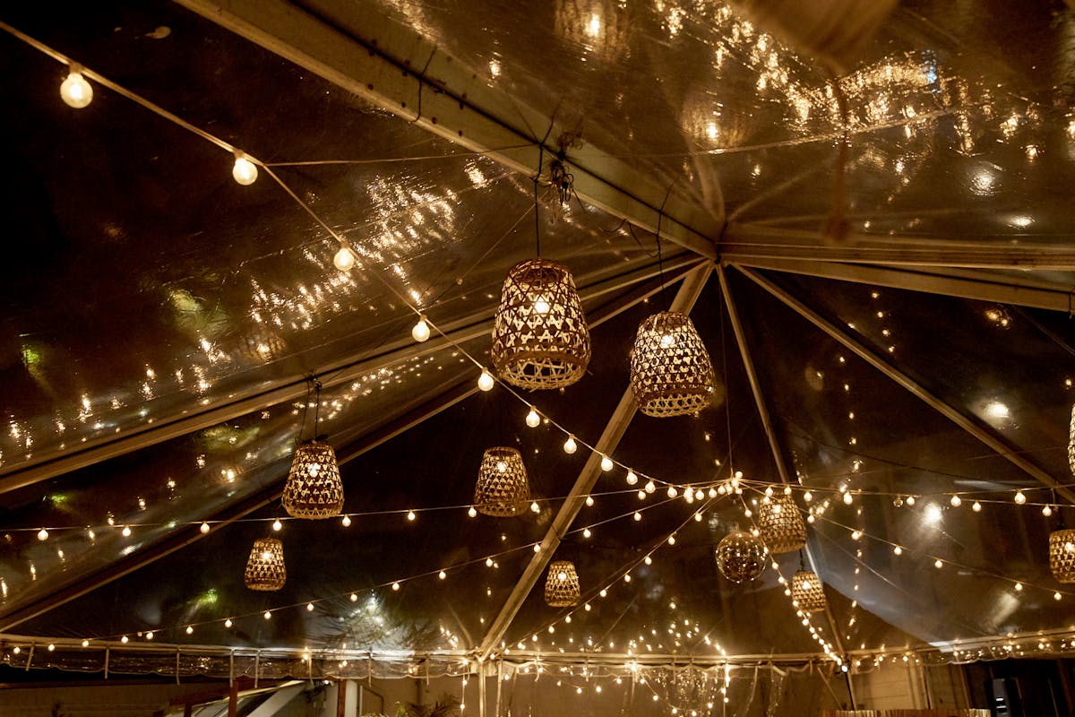 a close up of a ceiling light with a building in the background
