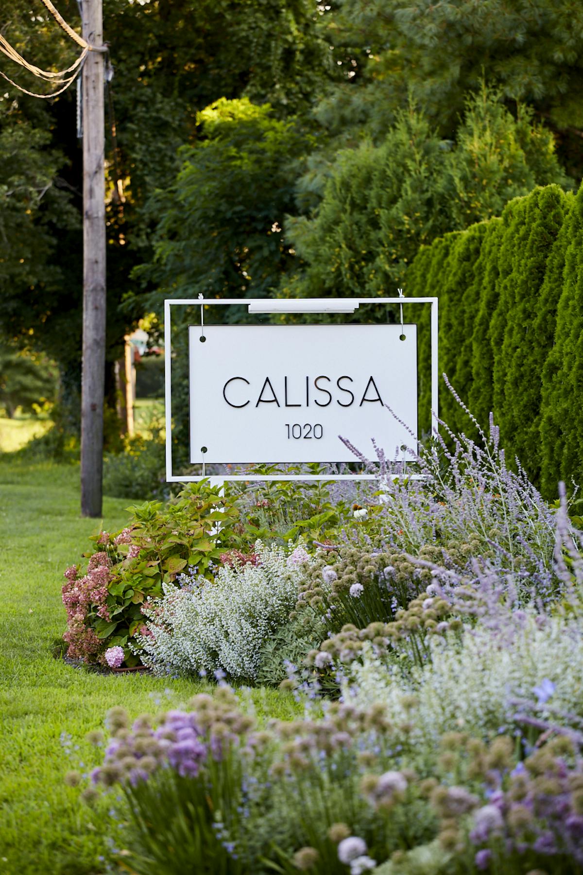 a sign in a garden