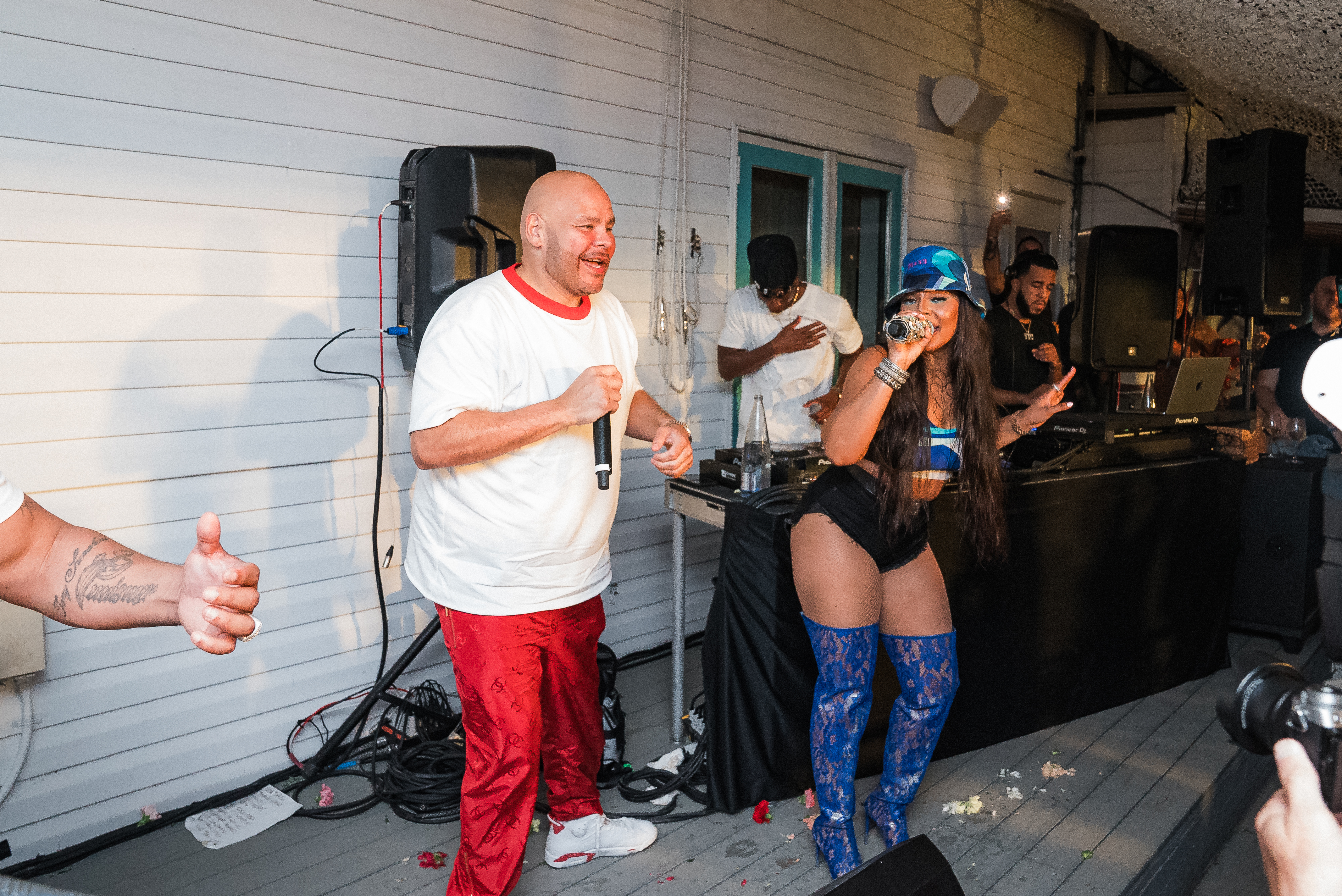Fat Joe et al. holding wine glasses