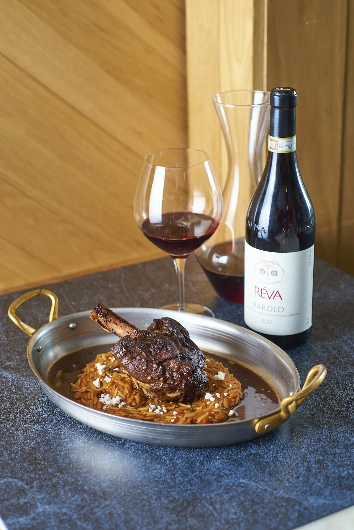 a plate of food and a bottle of wine