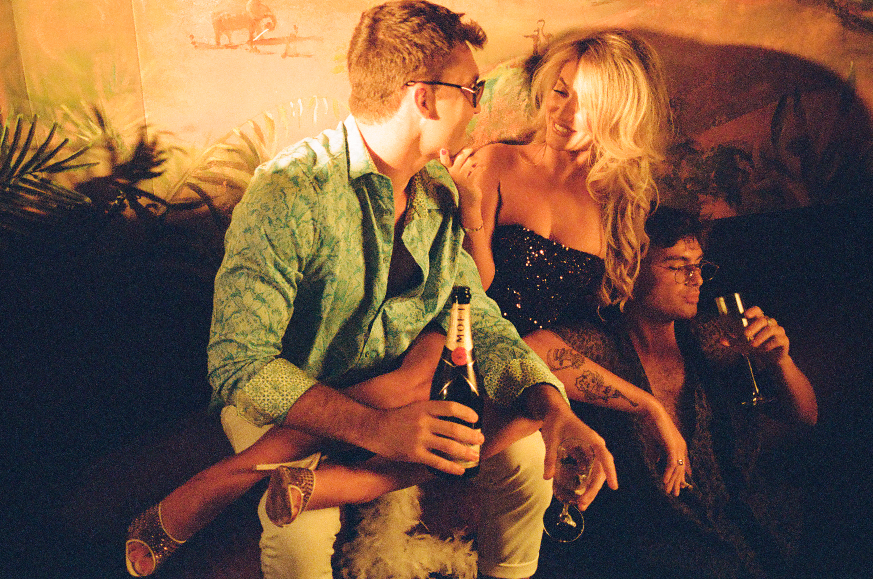 a group of people looking at a book