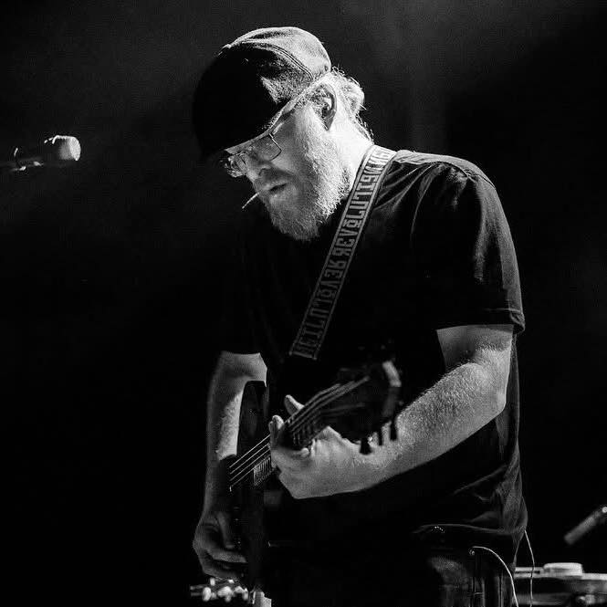 a man playing a guitar