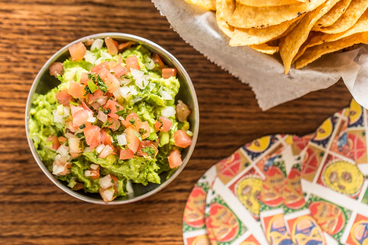 a bowl of food sitting on a table