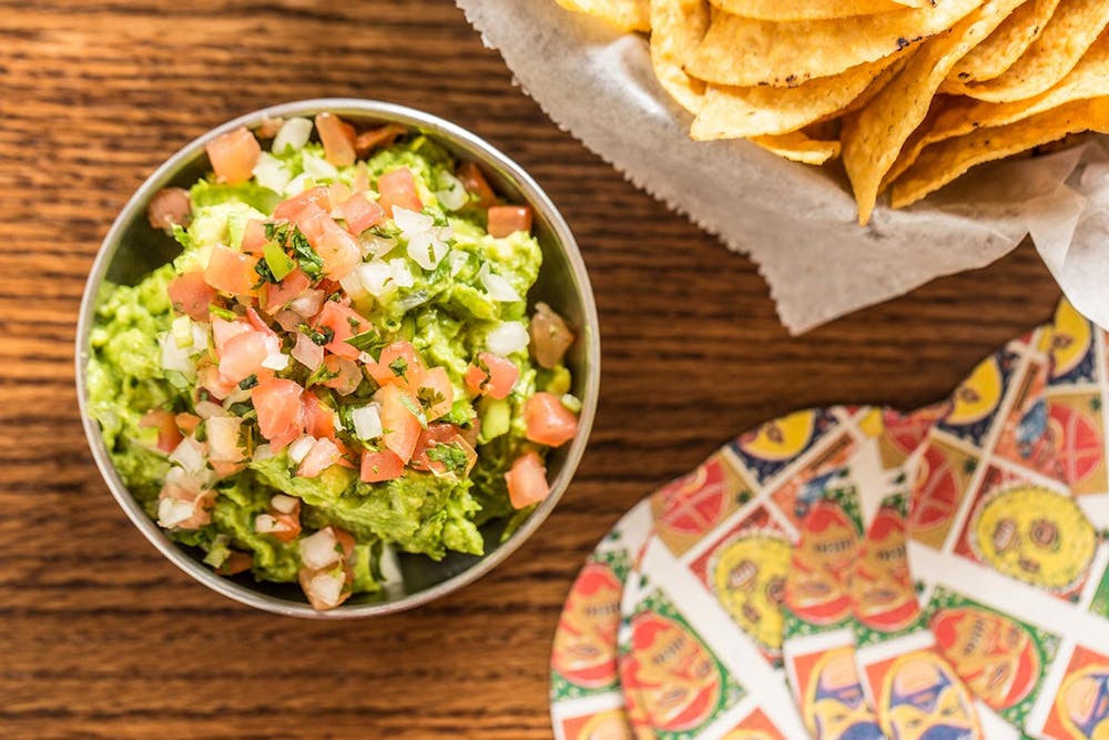 a bowl of food sitting on a table