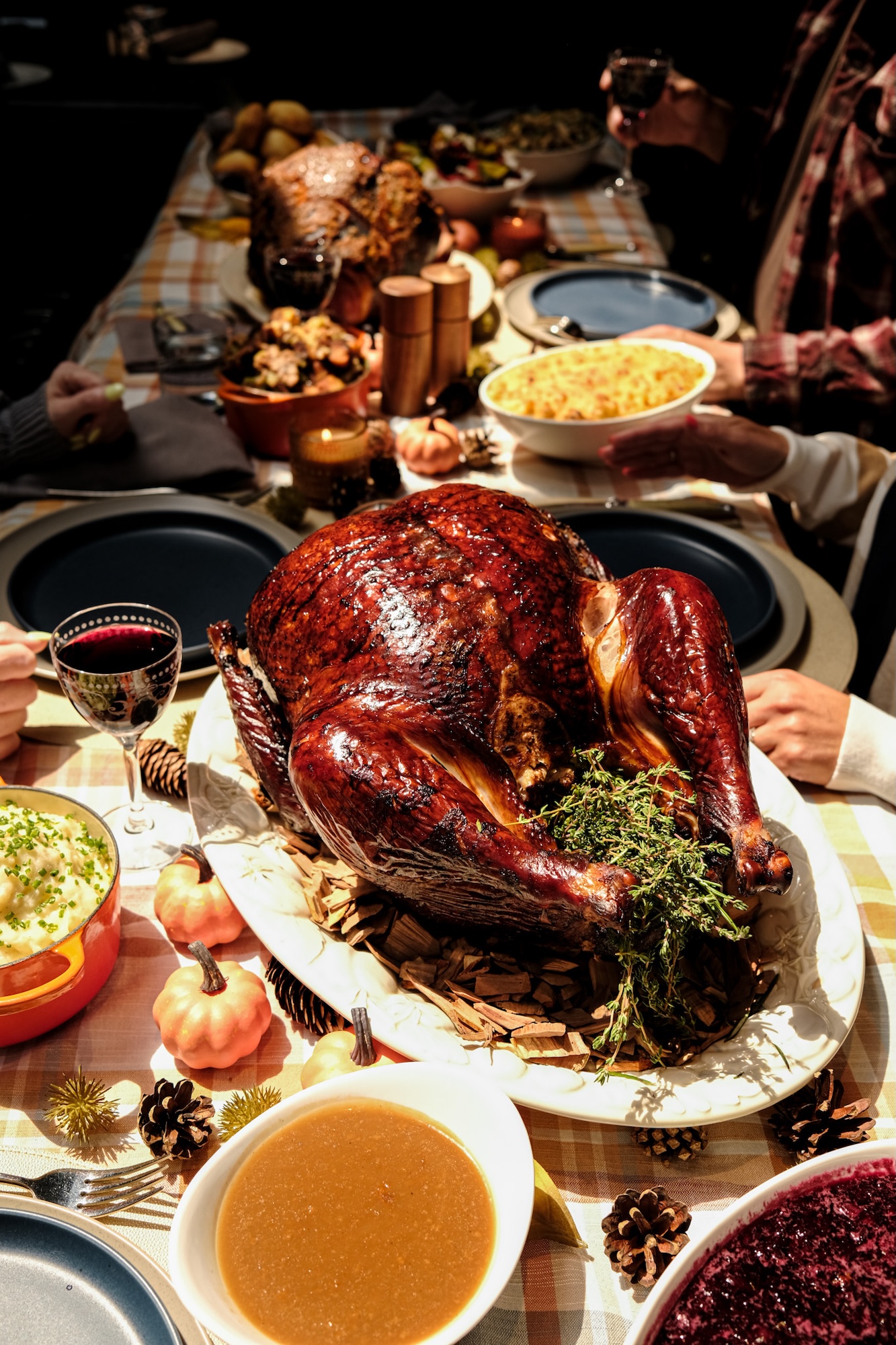 Table full of turkey and Thanksgiving sides