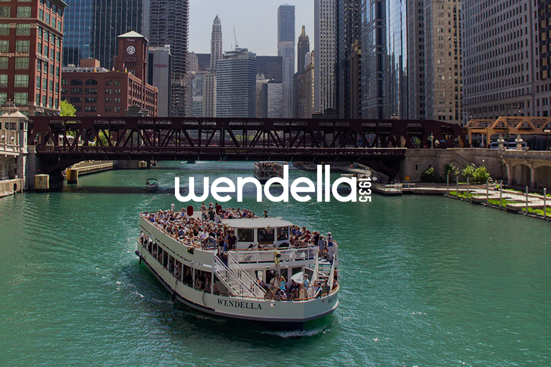 Boat full of people going down the Chicago River