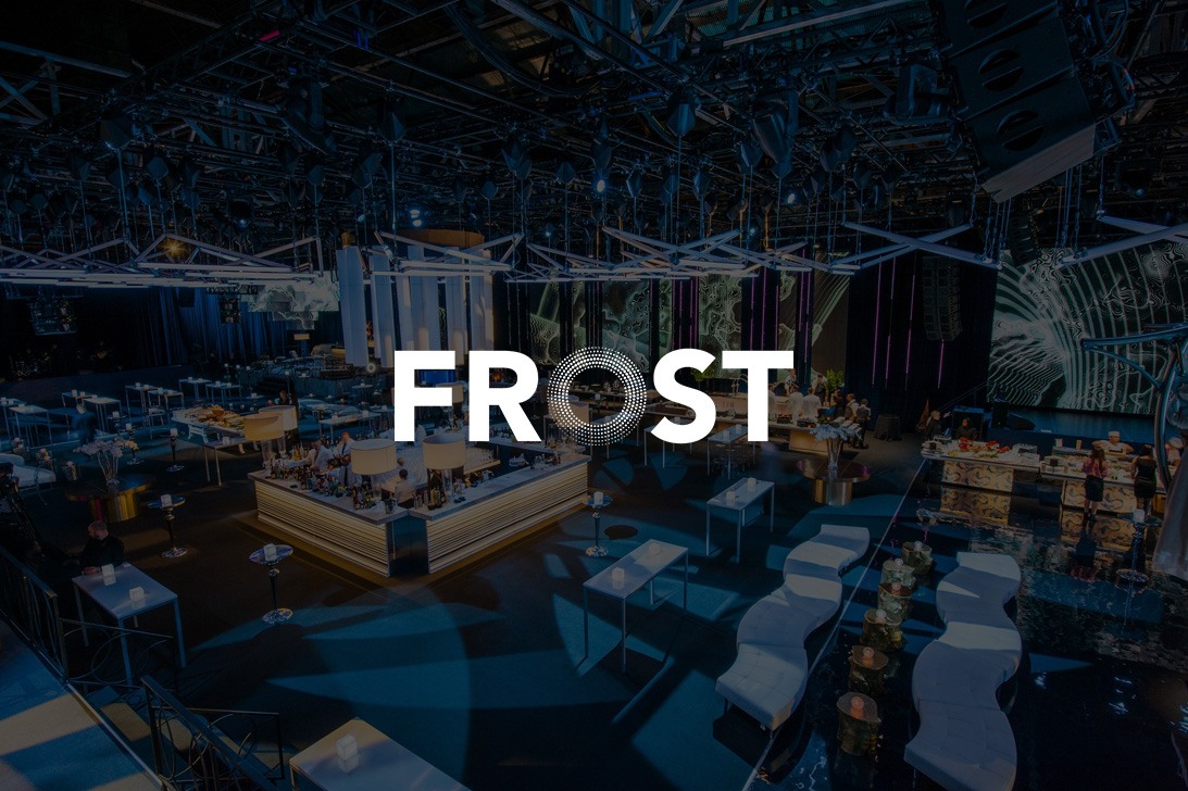 Frost logo over a ballroom set for an event, with lighting and A/V tech visible