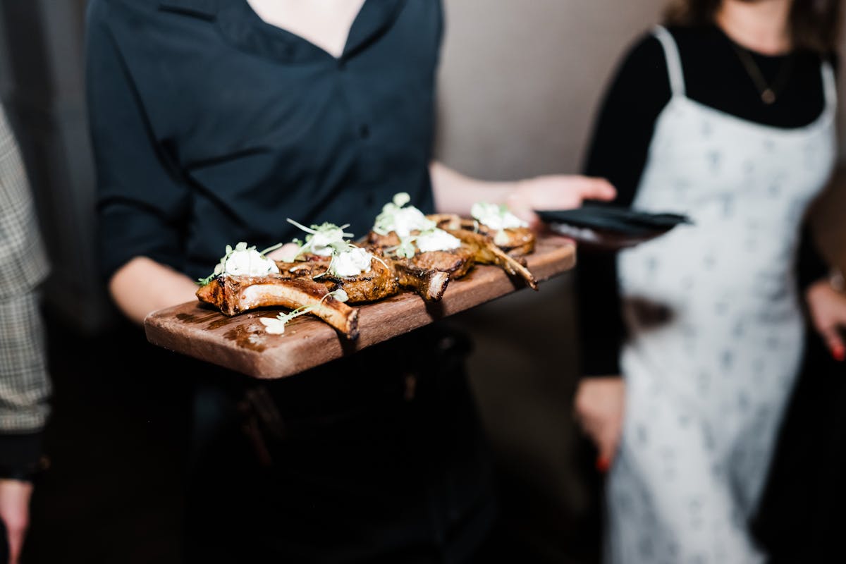 a person cutting a cake