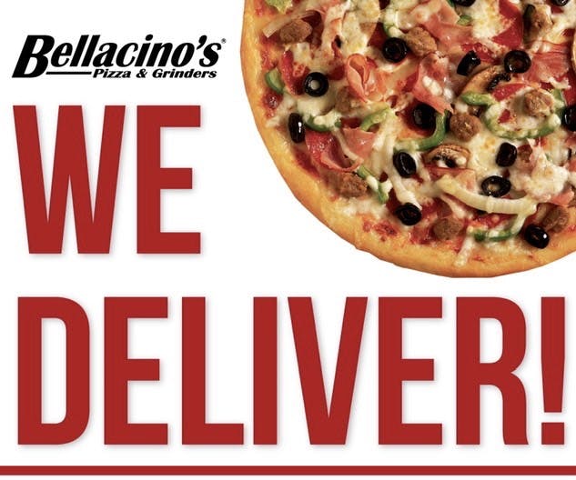 a pizza sitting on top of a sign