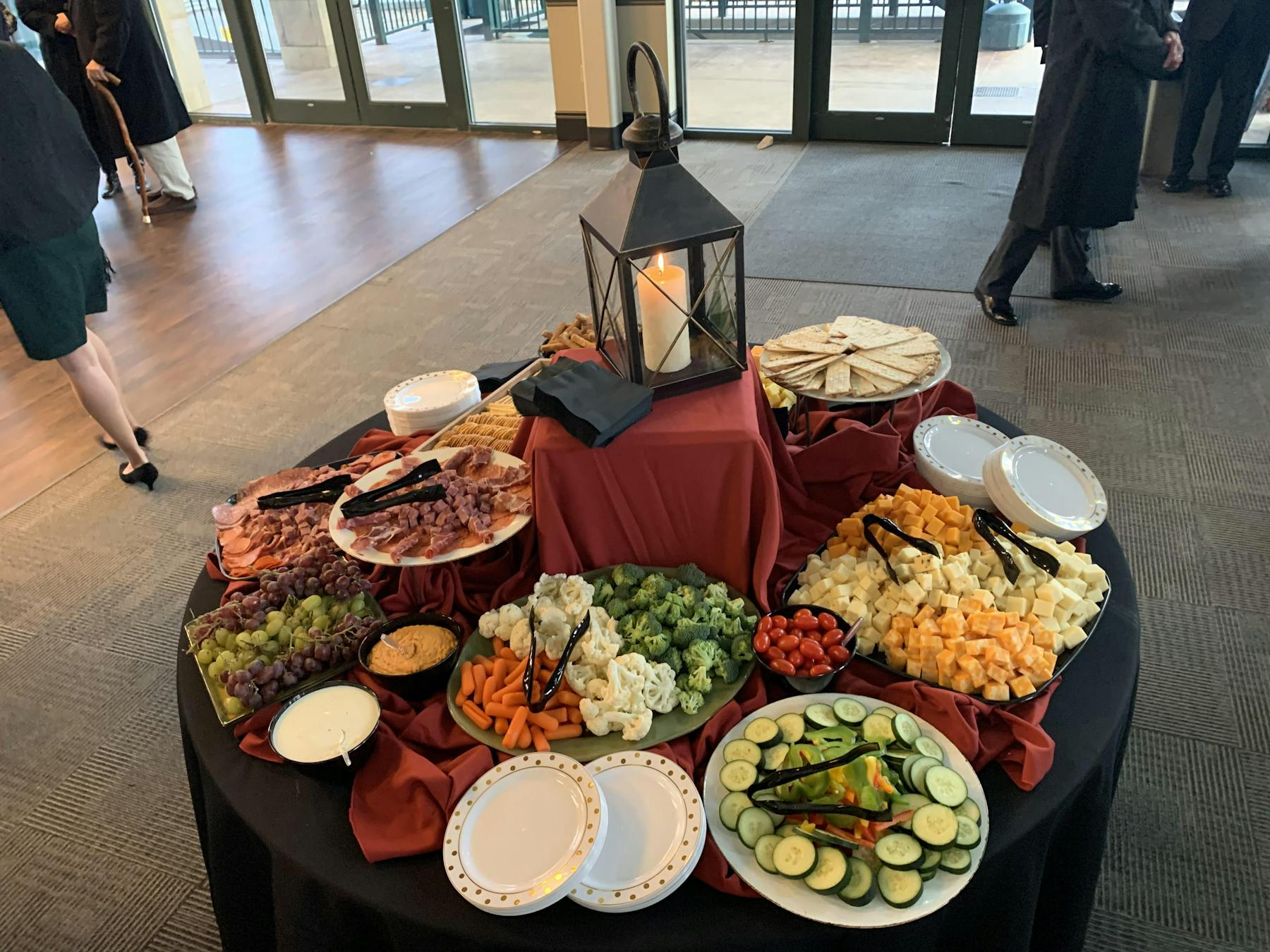 a group of people sitting at a table with food