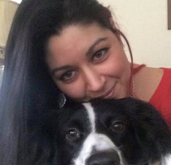 a person and a dog posing for the camera