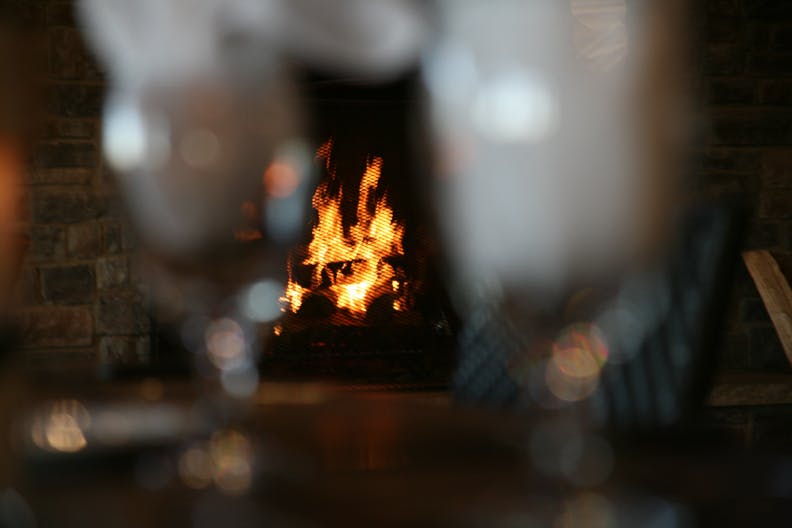 a blurry photo of a fire place sitting in front of a fireplace