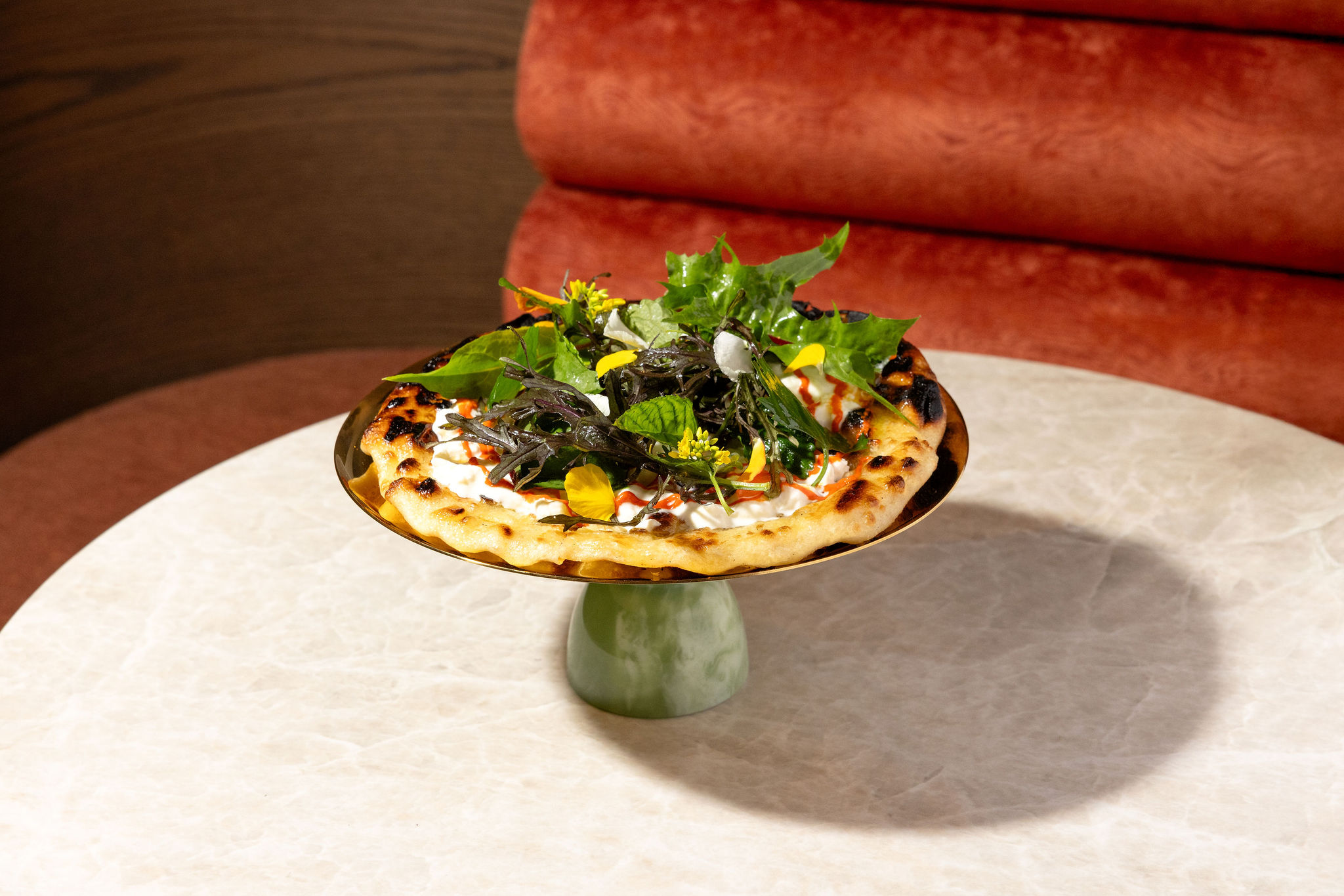 Markette’s signature flatbread with ricotta, chili oil, and fresh greens — a colorful favorite for romantic dinners in Chelsea NYC.