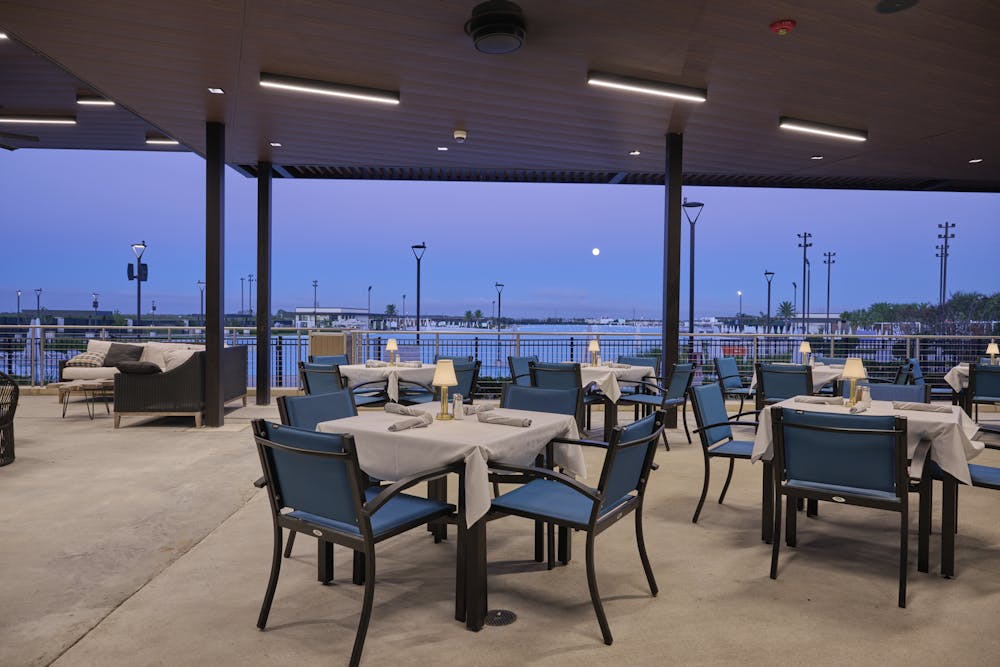 a table topped with a blue chair