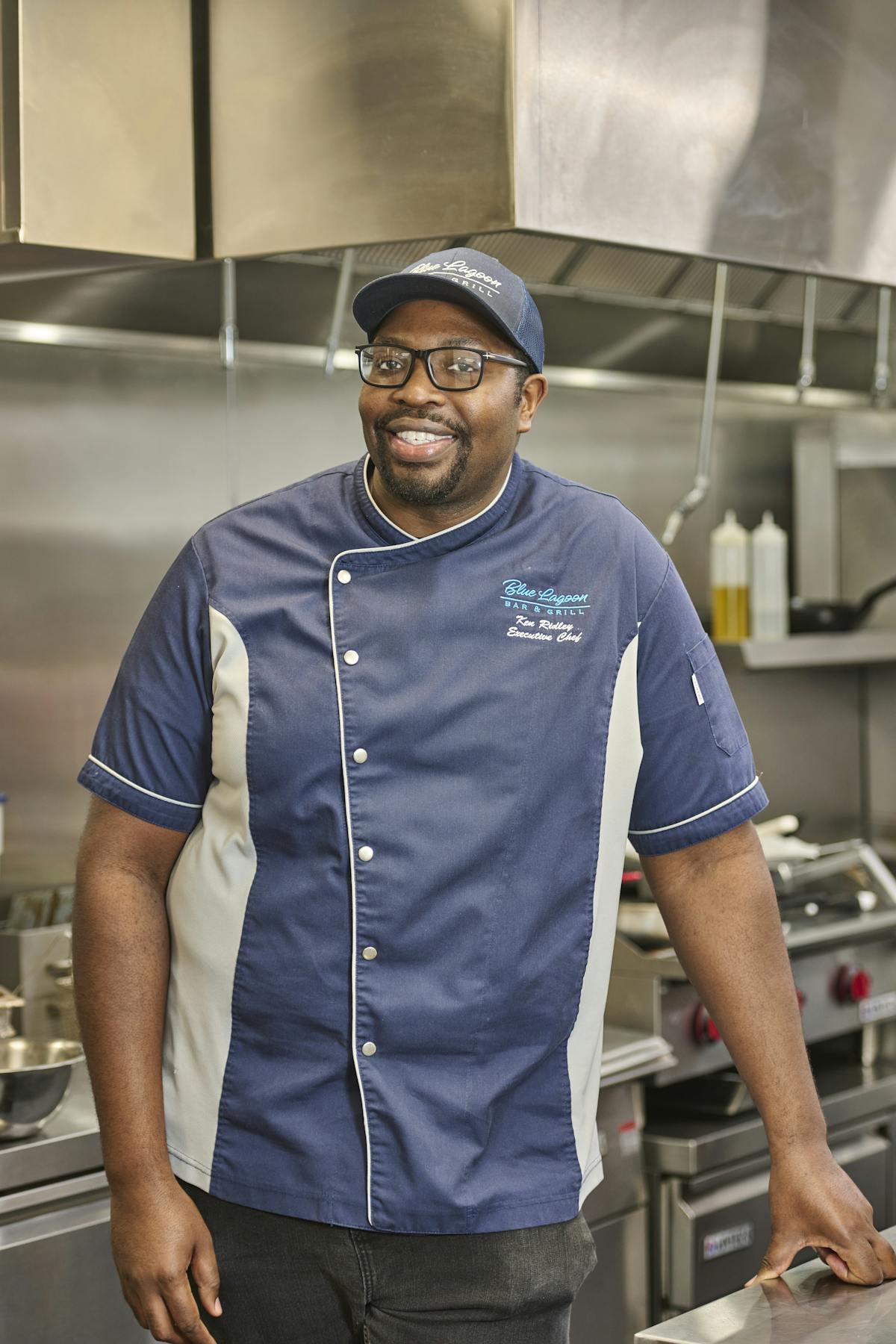 a man standing in a kitchen